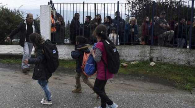 Refugee children face protest on first day of school